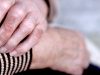 Wrist pain of older women. Elderly wrinkled skin palms massage injured join